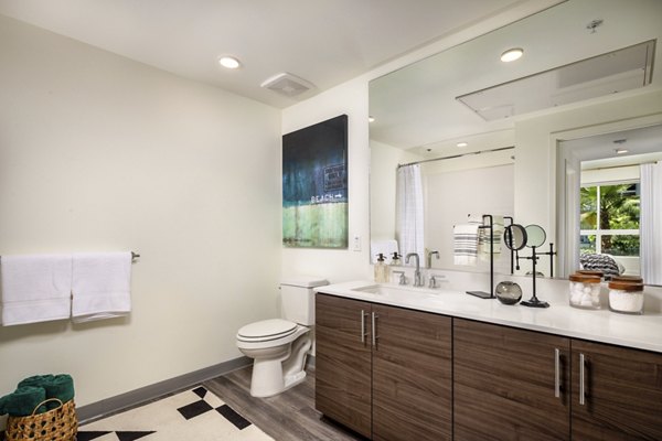 Bathroom with elegant white marble accents at Rise Hollywood Apartments, luxury living space with modern fixtures