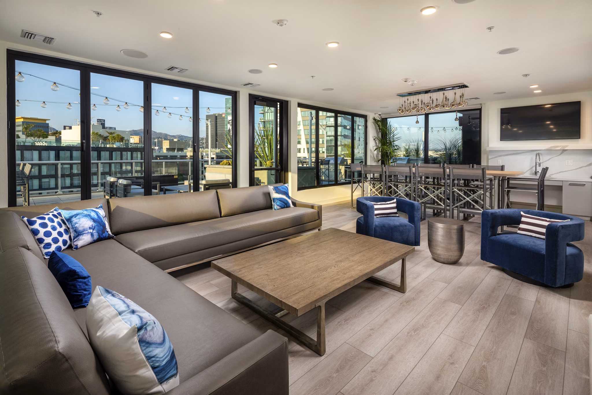 Clubhouse featuring modern design and ample seating at Rise Hollywood Apartments