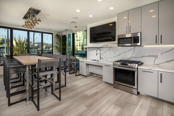Rise Hollywood Apartments: Stylish clubhouse with modern seating and decor, ideal for social gatherings and relaxation in Los Angeles