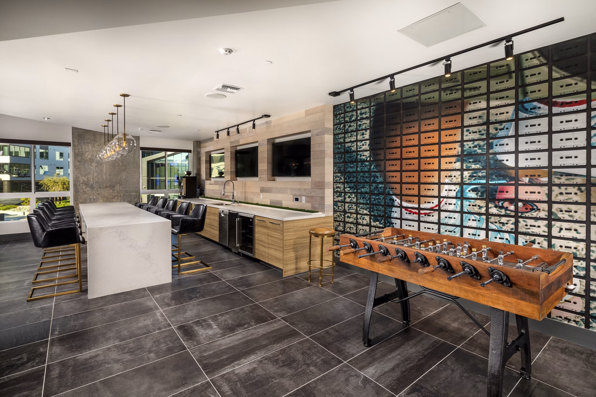 Rise Hollywood Apartments: Modern clubhouse featuring luxurious seating and entertainment areas, providing residents a relaxing and engaging community space
