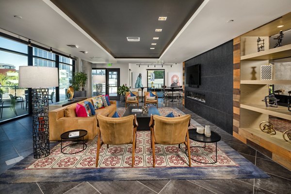 Rise Hollywood Apartments: Modern clubhouse with stylish design and comfortable seating areas for residents Perfect for leisure and community gatherings