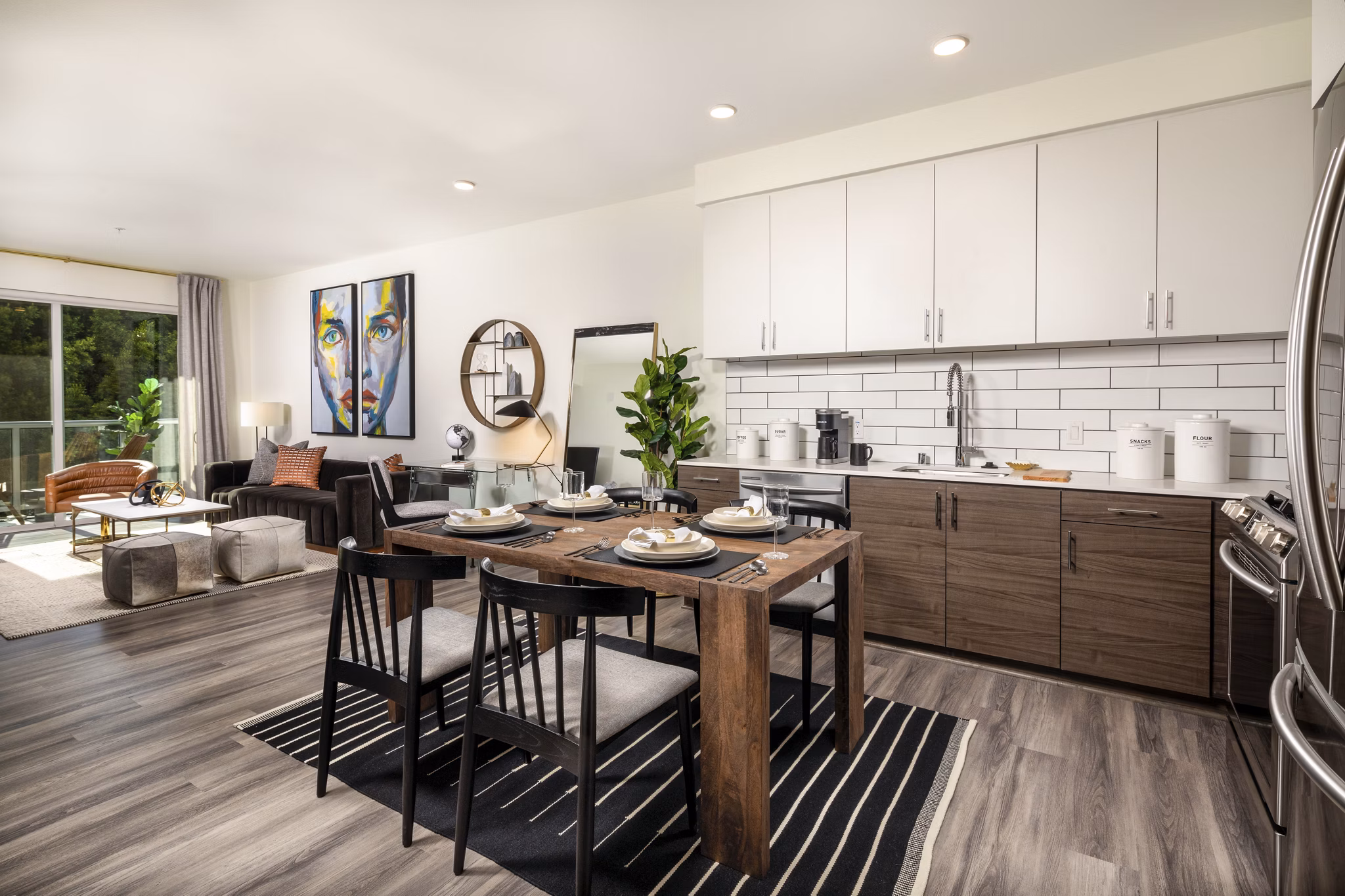 Modern dining area with sleek furniture in Rise Hollywood Apartments, featuring open layout perfect for entertaining in luxury urban setting