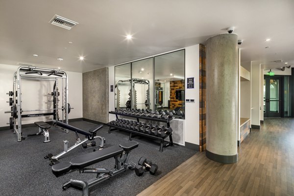 State-of-the-art fitness center with modern equipment at Rise Hollywood Apartments