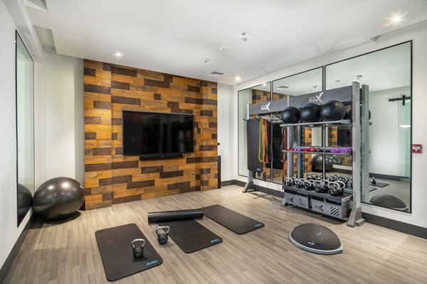 Well-equipped yoga/spin studio with modern exercise equipment at Rise Hollywood Apartments, perfect for fitness enthusiasts