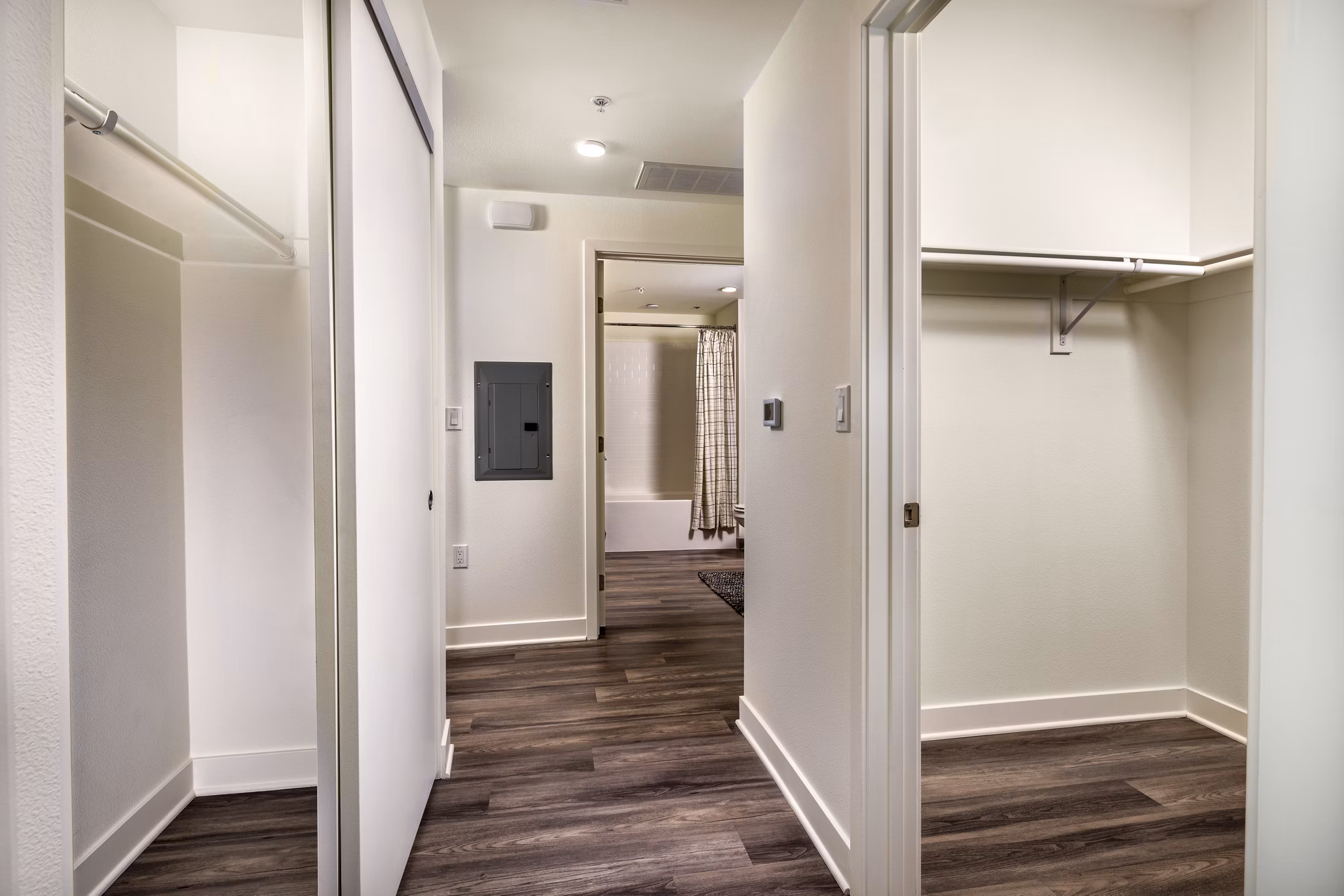 Elegant hallway with modern lighting and artwork at Rise Hollywood Apartments