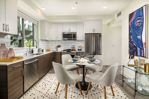 Modern kitchen with stainless steel appliances at Rise Hollywood Apartments