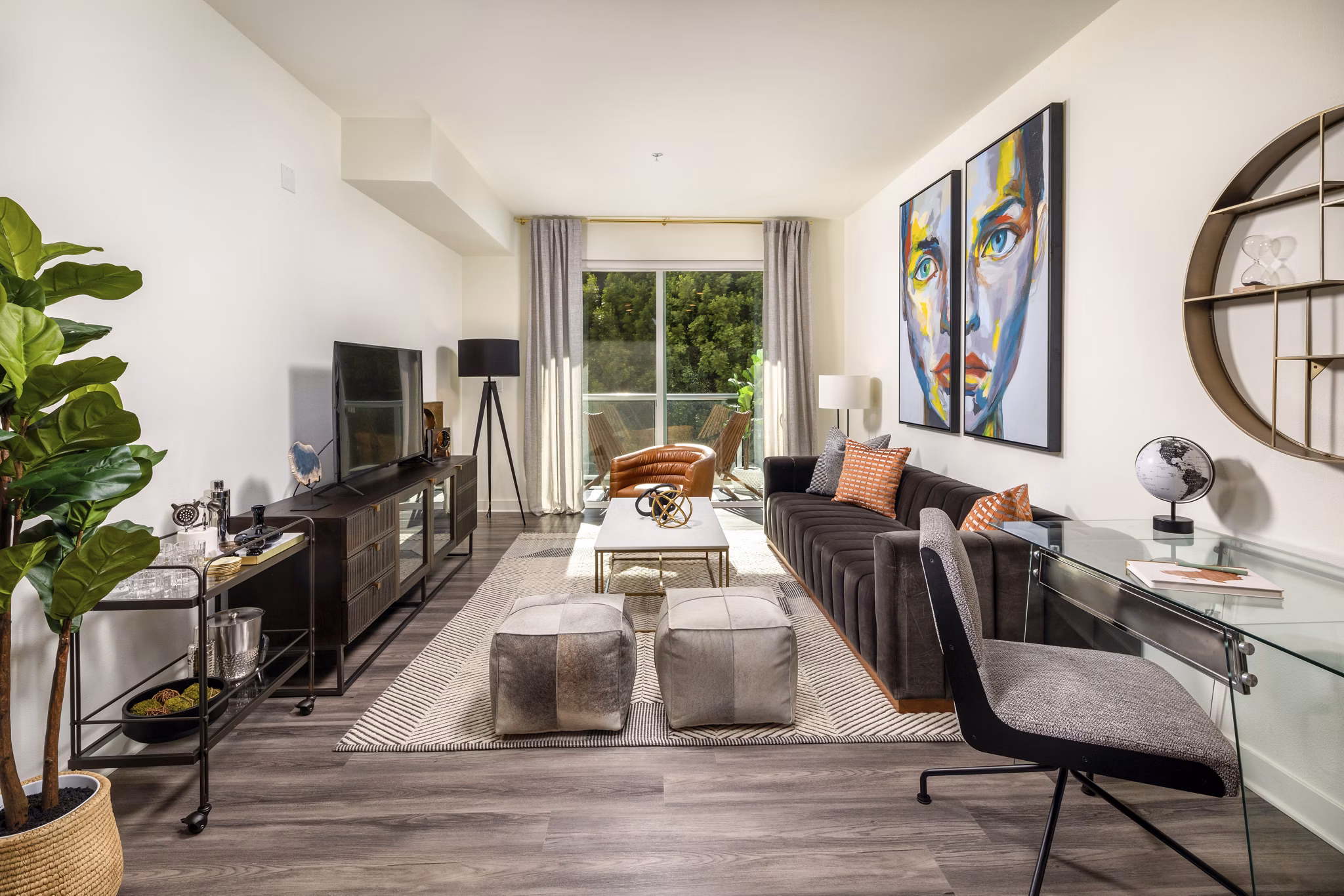 Spacious living room with modern decor at Rise Hollywood Apartments featuring luxury amenities and vibrant city views