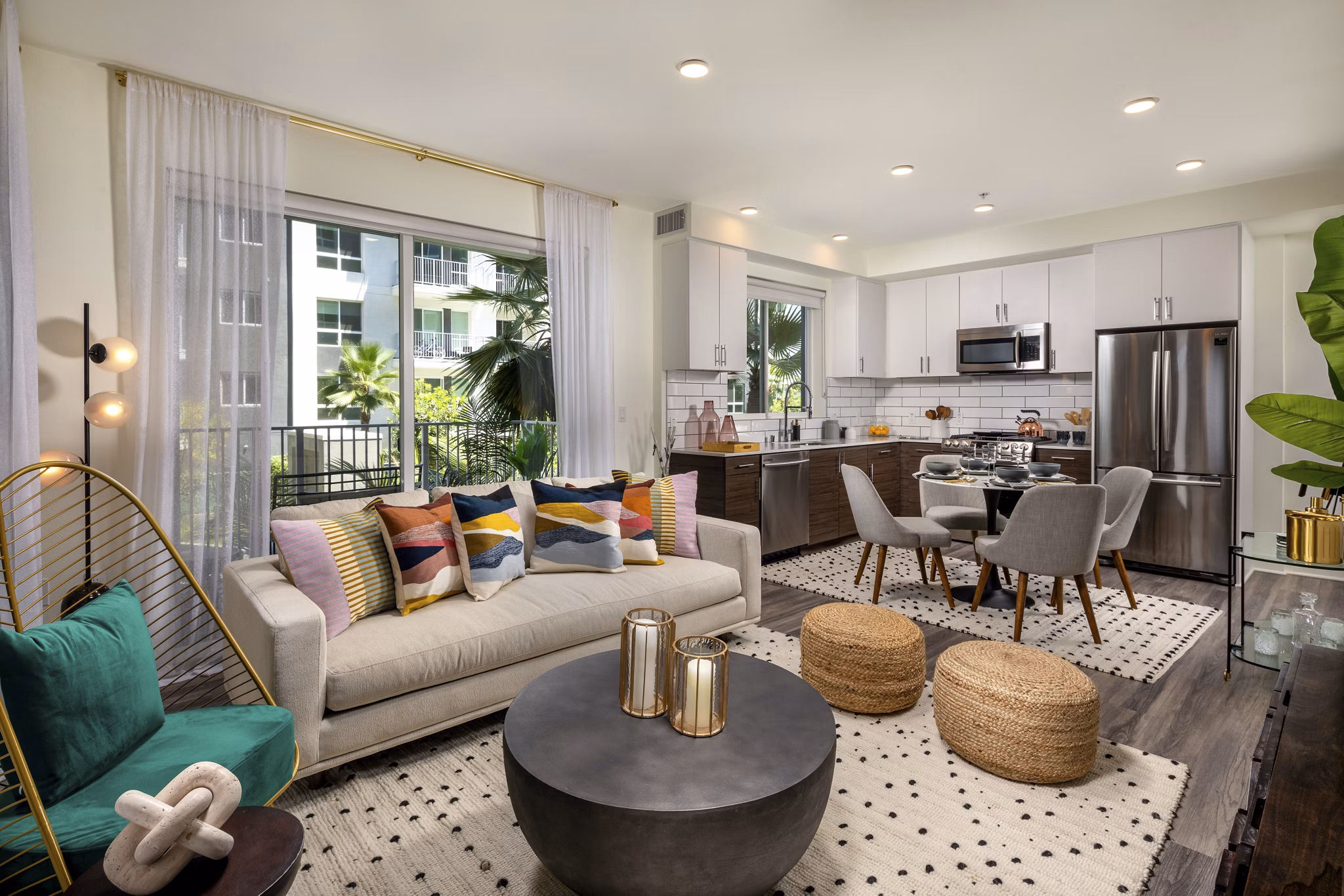 Contemporary living room with stylish decor and large windows at Rise Hollywood Apartments