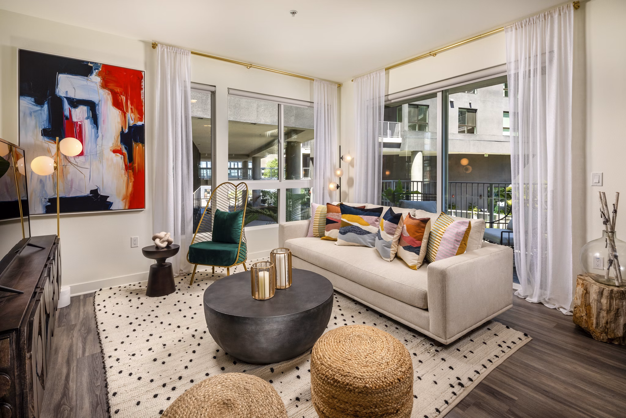 Spacious living room with modern decor and open layout at Rise Hollywood Apartments