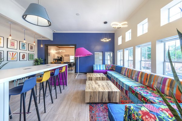 Clubhouse at Hillside Ranch Apartments: Modern communal space with seating and entertainment options