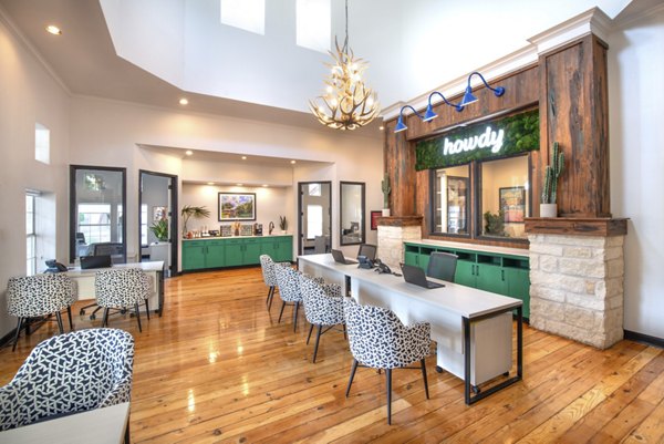 Clubhouse with modern furnishings at Hillside Ranch Apartments offering luxury amenities for social gatherings