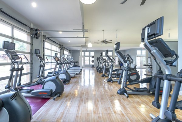 Modern fitness center with cardio and strength equipment at Hillside Ranch Apartments Ideal for an active lifestyle in luxury living