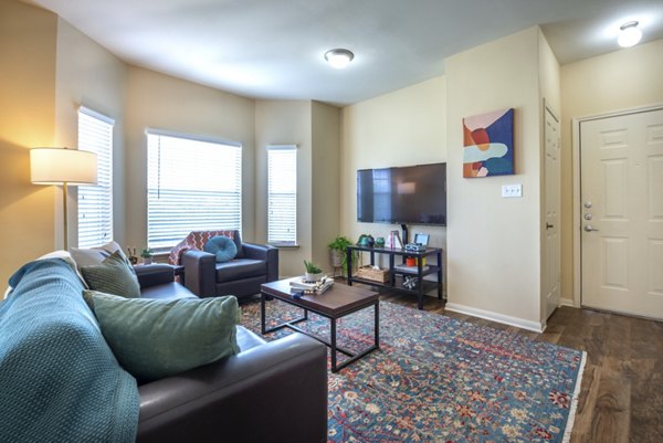 Spacious living room with modern decor at Hillside Ranch Apartments, offering a comfortable living space for residents