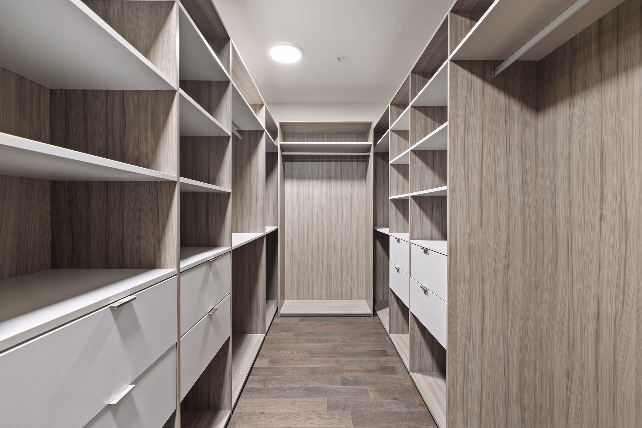 Walk-in closet with ample storage space in The Westcott Apartments