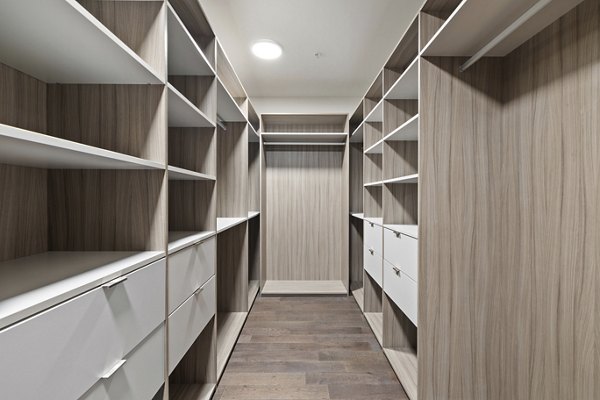 Walk-in closet with ample storage space in The Westcott Apartments