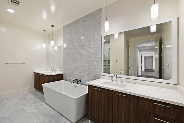Modern bathroom with sleek fixtures at The Westcott Apartments in Houston