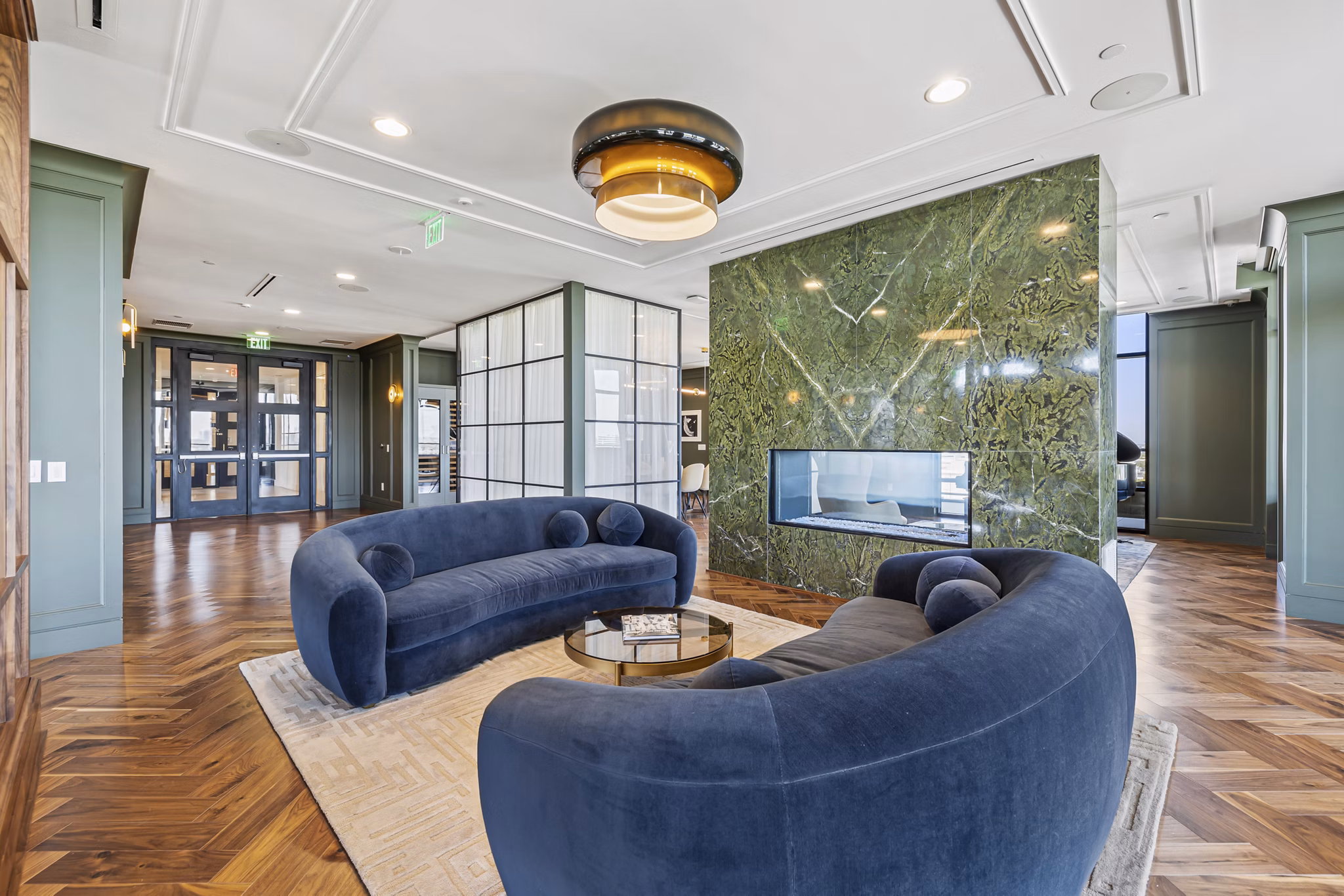 The Westcott Clubhouse: Elegant social space with cozy seating and modern decor at luxury Greystar apartments
