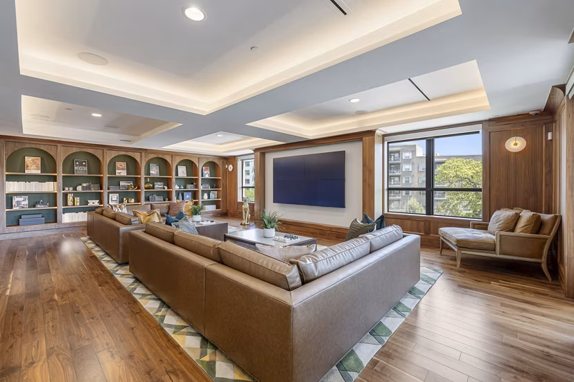 Theater room with plush seating and large screen at The Westcott Apartments, luxury community by Greystar