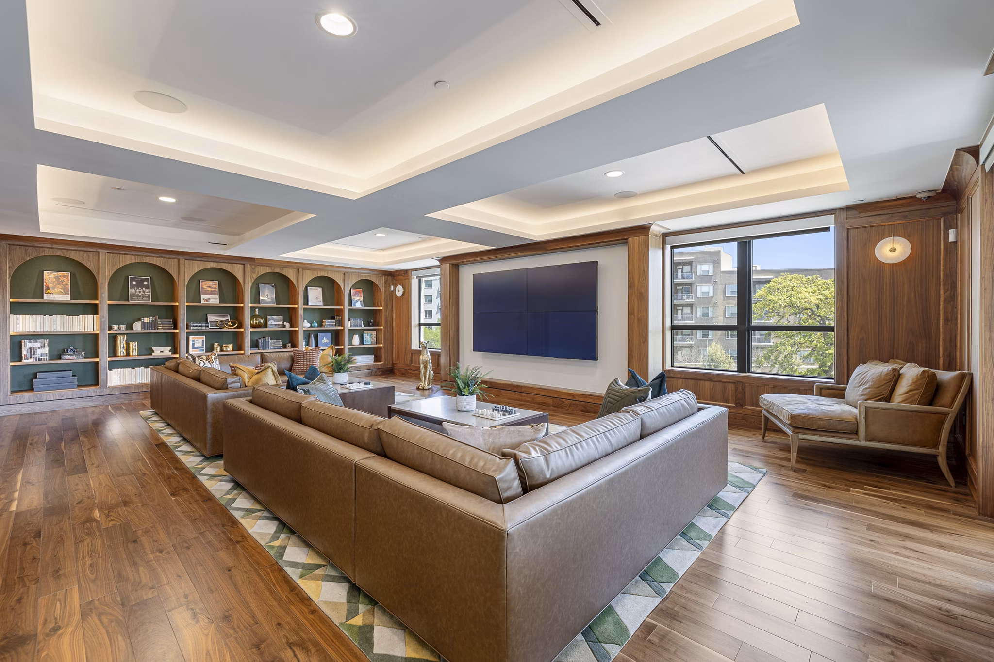 Theater room with plush seating and large screen at The Westcott Apartments, luxury community by Greystar