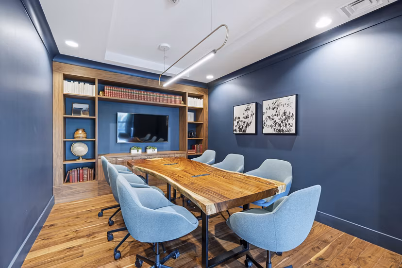 Meeting facility with advanced tech setup at The Westcott Apartments, ideal for tenant gatherings and events in a modern luxury setting