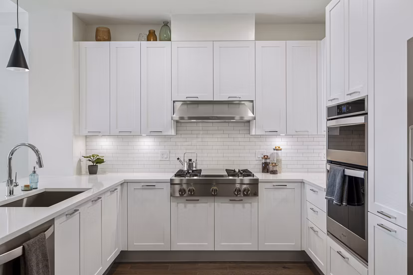 Modern kitchen with sleek cabinetry and stainless steel appliances in The Westcott Apartments