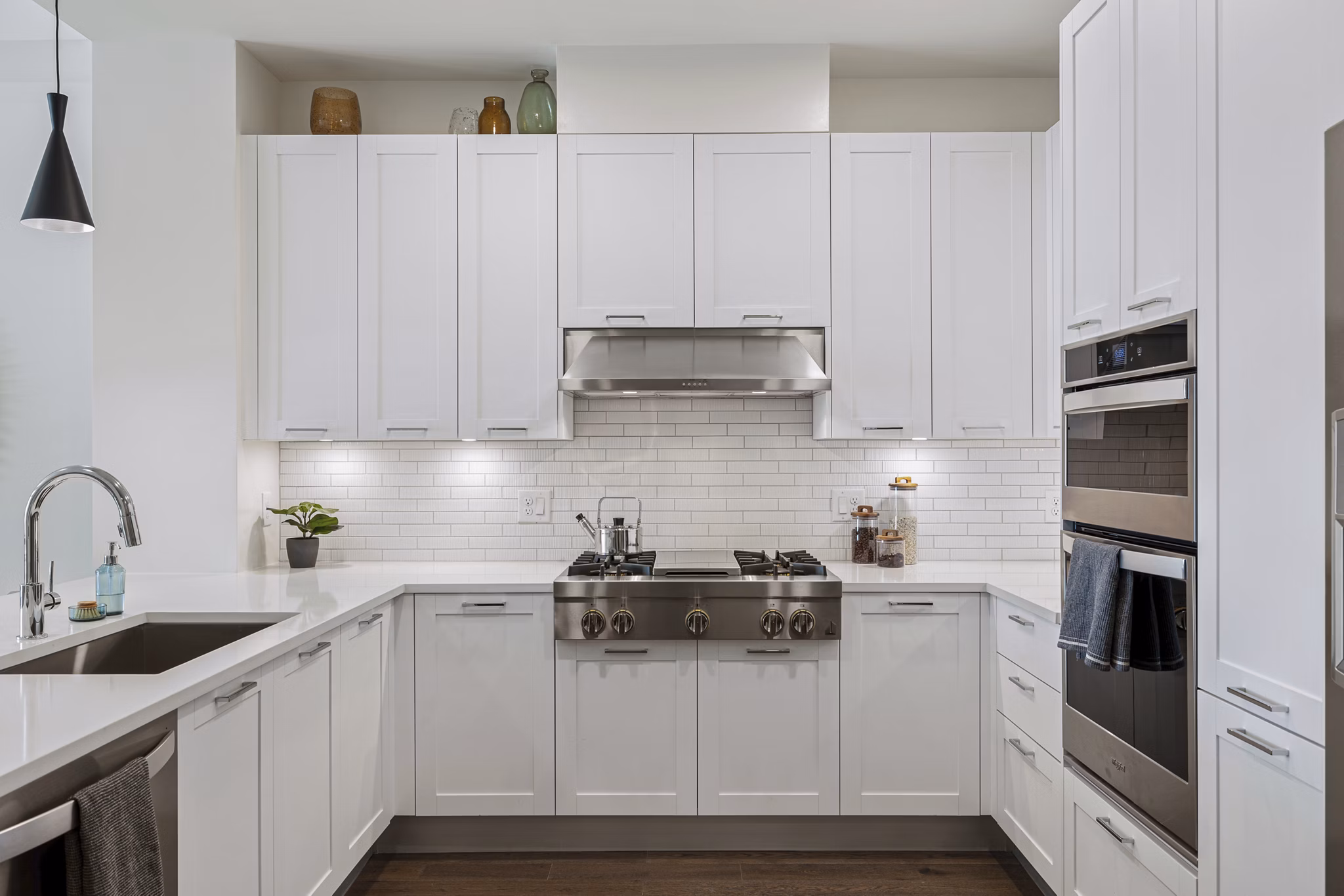 Modern kitchen with sleek cabinetry and stainless steel appliances in The Westcott Apartments