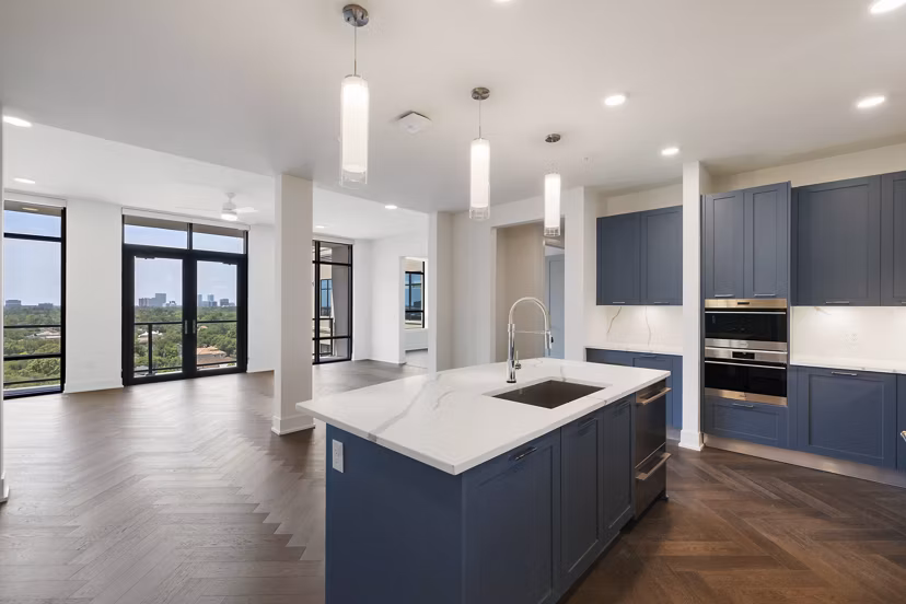 Modern kitchen featuring stainless steel appliances at The Westcott Apartments