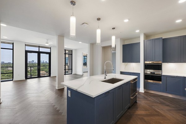Modern kitchen featuring stainless steel appliances at The Westcott Apartments