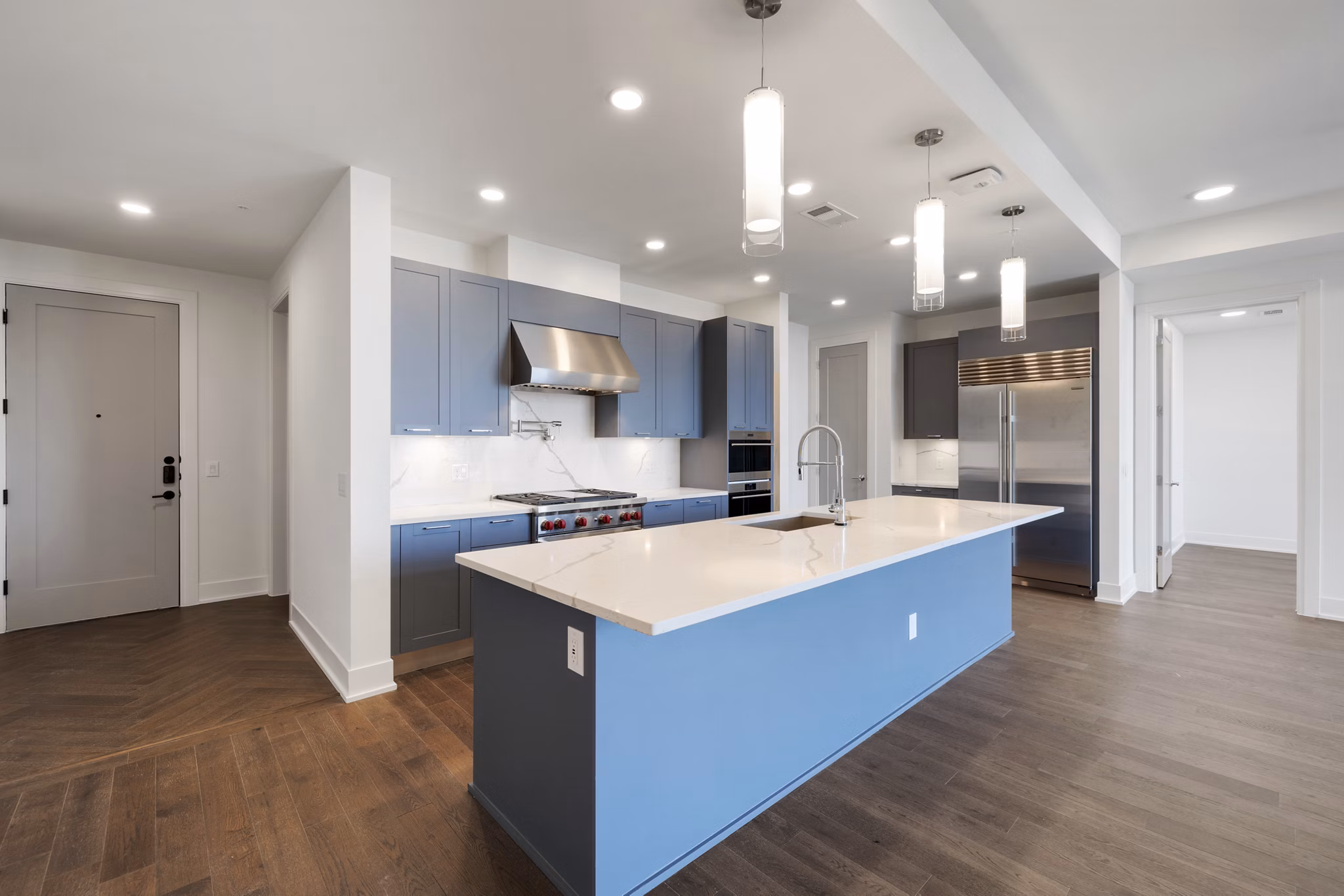 Open-concept kitchen with modern appliances at The Westcott Apartments