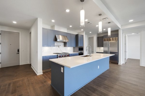 Open-concept kitchen with modern appliances at The Westcott Apartments