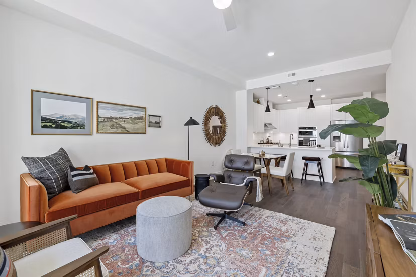 Spacious living room with modern decor at The Westcott Apartments, luxury rentals near popular urban amenities, ideal for contemporary living