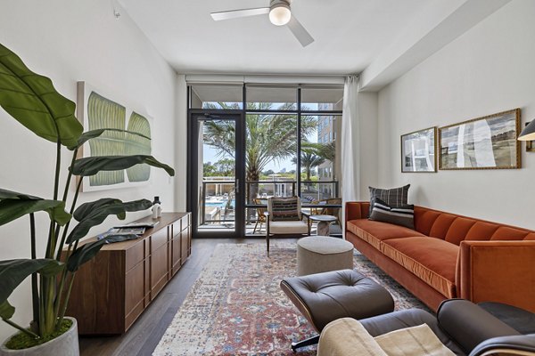 Spacious living room with stylish decor in The Westcott Apartments