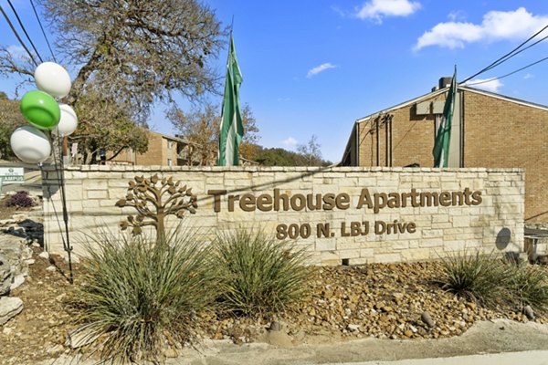 signage at Treehouse Apartments