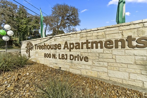 Signage for Treehouse Apartments: Luxury apartment living in a tranquil forest setting, offering premium amenities for residents