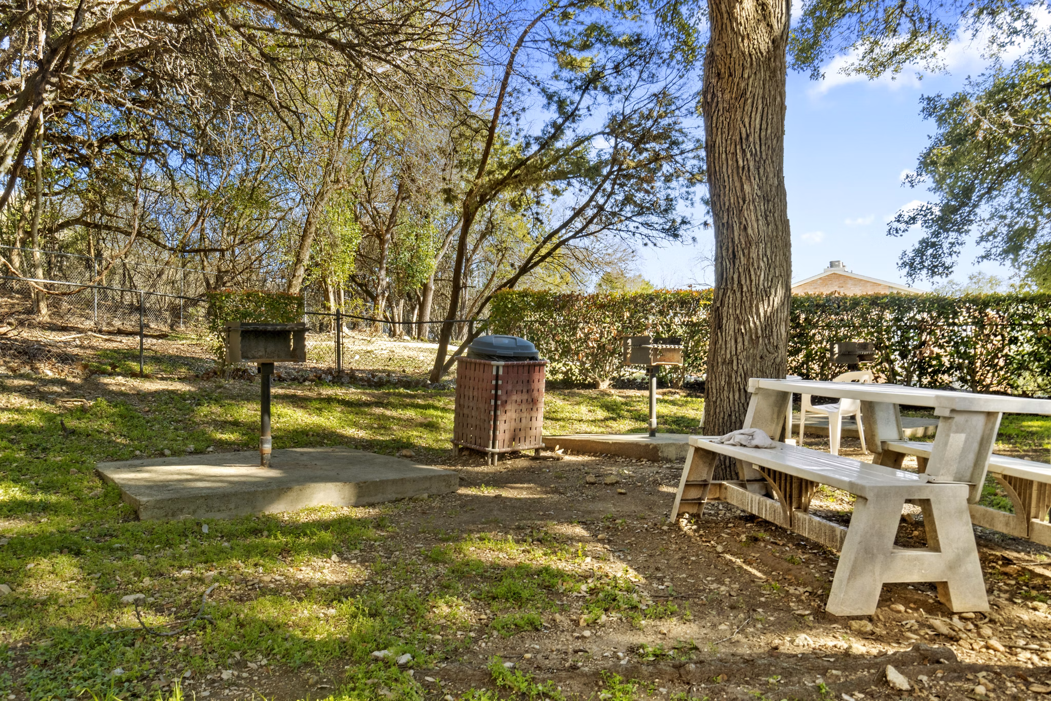 Outdoor grill area with modern seating at Treehouse Apartments, a luxury community offering premium amenities for entertaining and relaxation