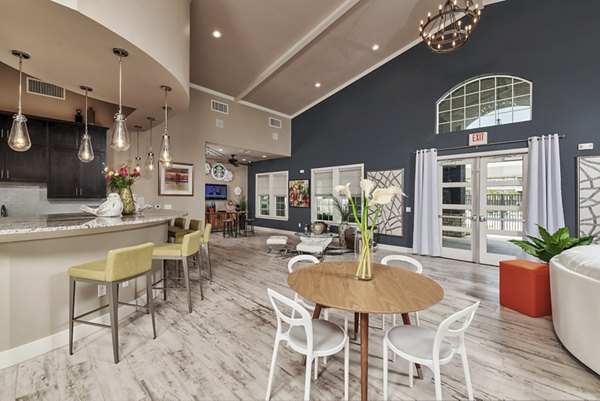 Clubhouse featuring modern design and open seating at Roots at Waco Apartments, ideal for community gatherings and social events