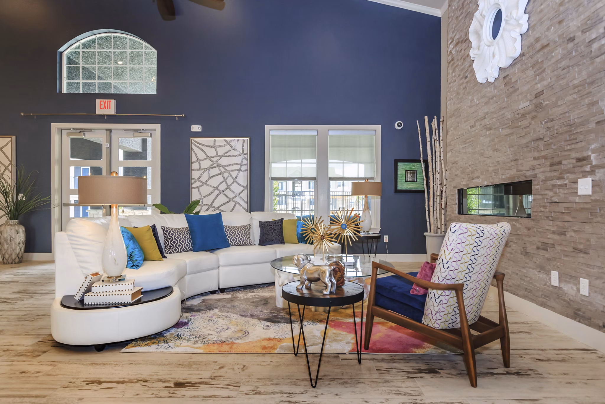 Spacious clubhouse with modern furnishings at Roots at Waco Apartments offering luxury lifestyle amenities