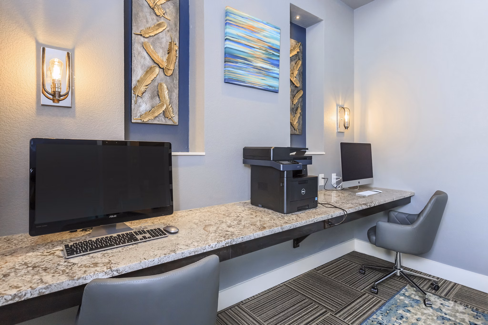 Business center with modern workstations at Roots at Waco Apartments