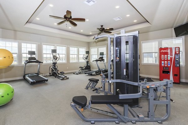 Modern fitness center with state-of-the-art equipment at Roots at Waco Apartments