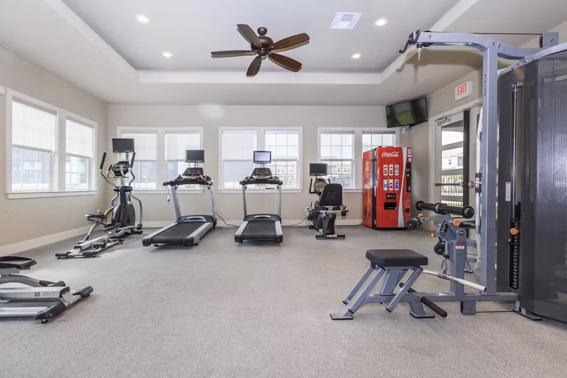 State-of-the-art fitness center at Roots at Waco Apartments offering modern gym equipment and spacious workout areas