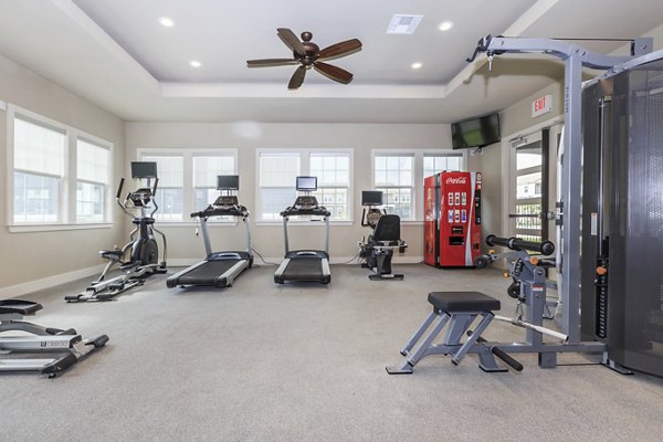 State-of-the-art fitness center at Roots at Waco Apartments offering modern gym equipment and spacious workout areas