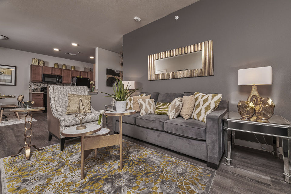 Living room featuring modern furniture and ample natural light at Roots at Waco Apartments, luxury residences in Waco