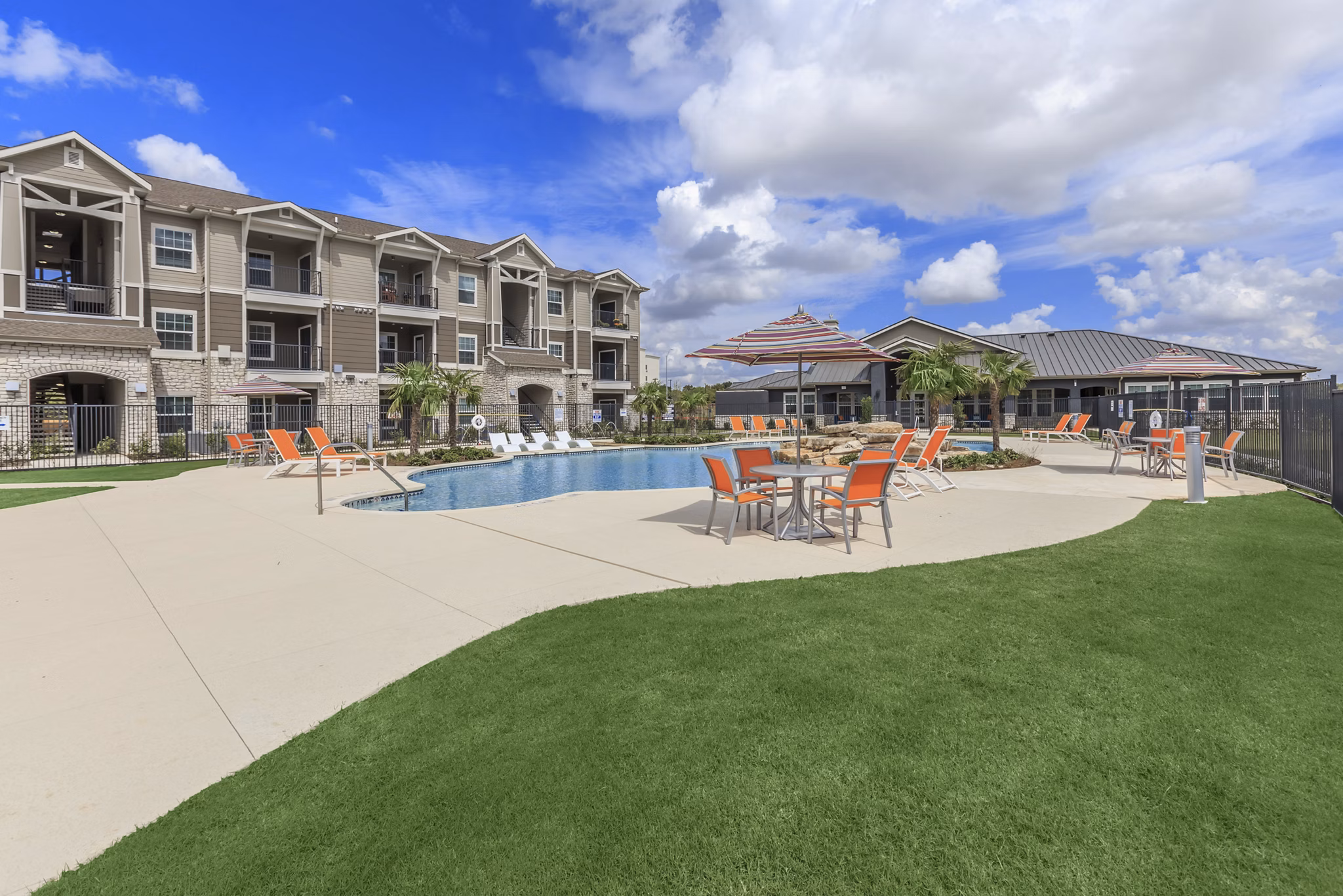 Rooftop infinity pool at Roots at Waco Apartments offering relaxing leisure and stunning views