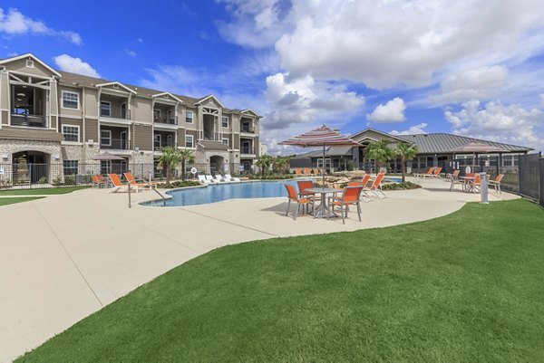 Rooftop infinity pool at Roots at Waco Apartments offering relaxing leisure and stunning views