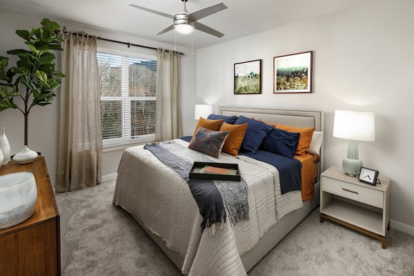 Luxurious bedroom with elegant design elements at Overture Powers Ferry Apartments