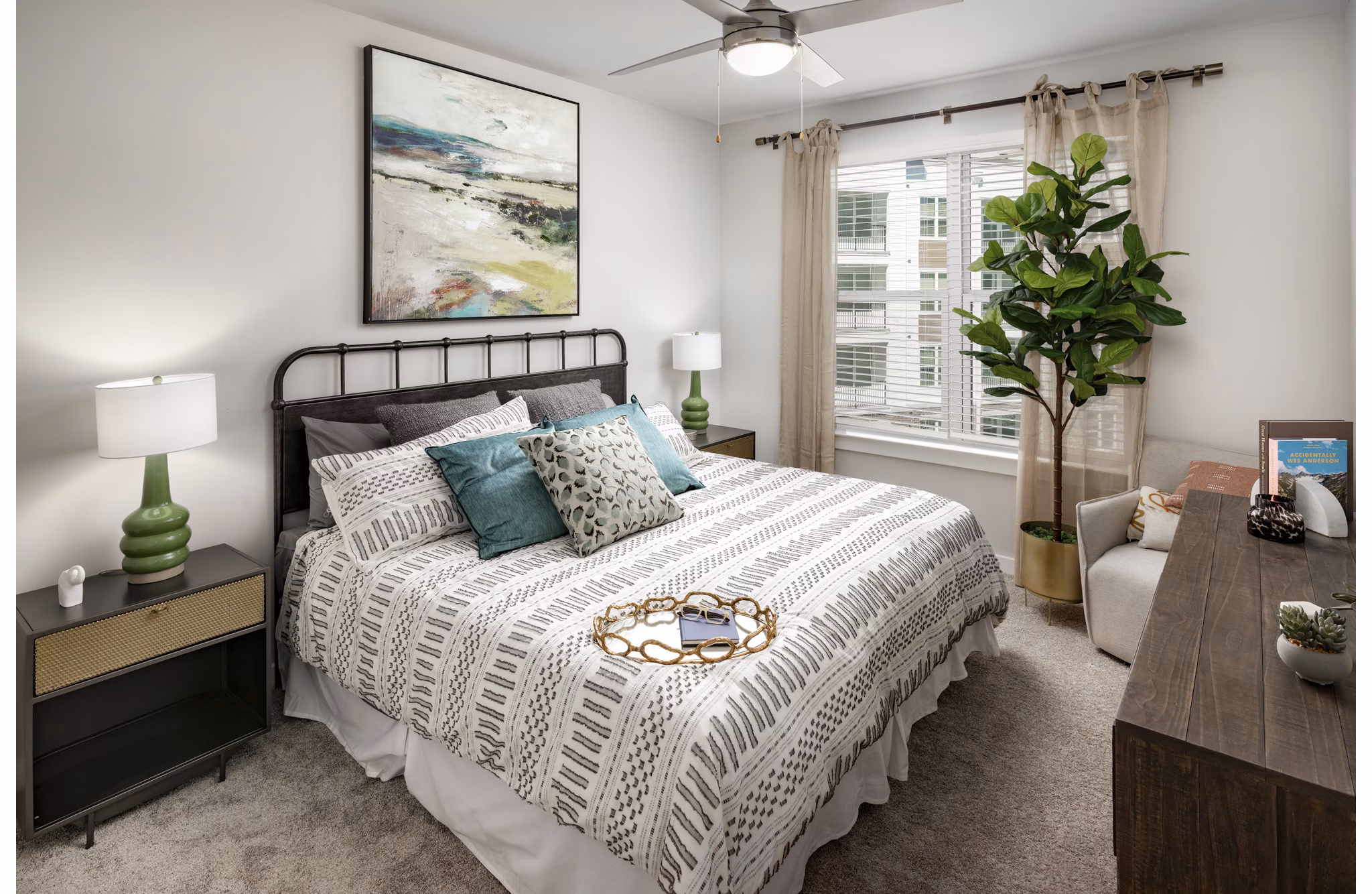 Bedroom featuring elegant decor and large windows at Overture Powers Ferry Apartments