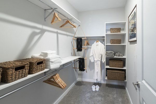 Walk-in closet with custom shelving in Overture Powers Ferry Apartments