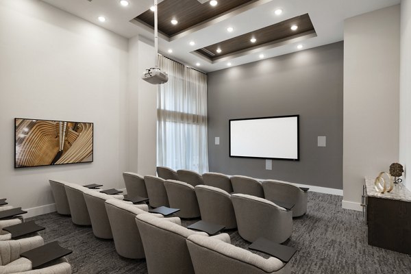 Indoor theater with plush seating and large screen at Overture Powers Ferry Apartments for luxury entertainment experiences