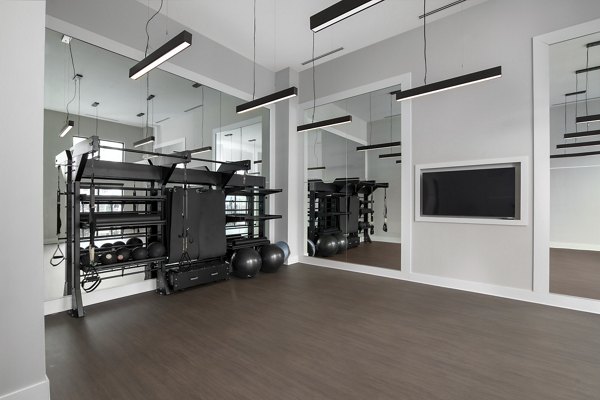 State-of-the-art fitness center at Overture Powers Ferry Apartments offering modern equipment and spacious workout areas