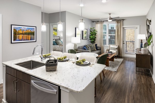 Kitchen with modern appliances and sleek cabinetry at Overture Powers Ferry Apartments